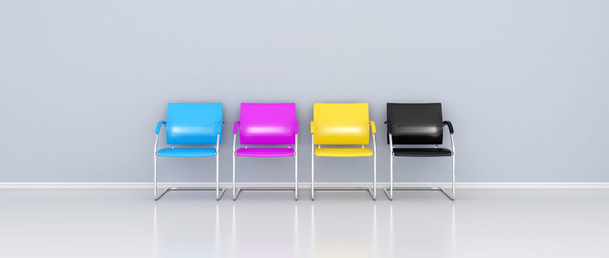 Four chairs in cyan, magenta, yellow and black — the CMYK colours of print